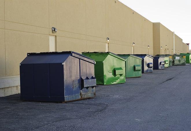 a collection of bright and vibrant dumpsters in a construction zone in Broadview, IL